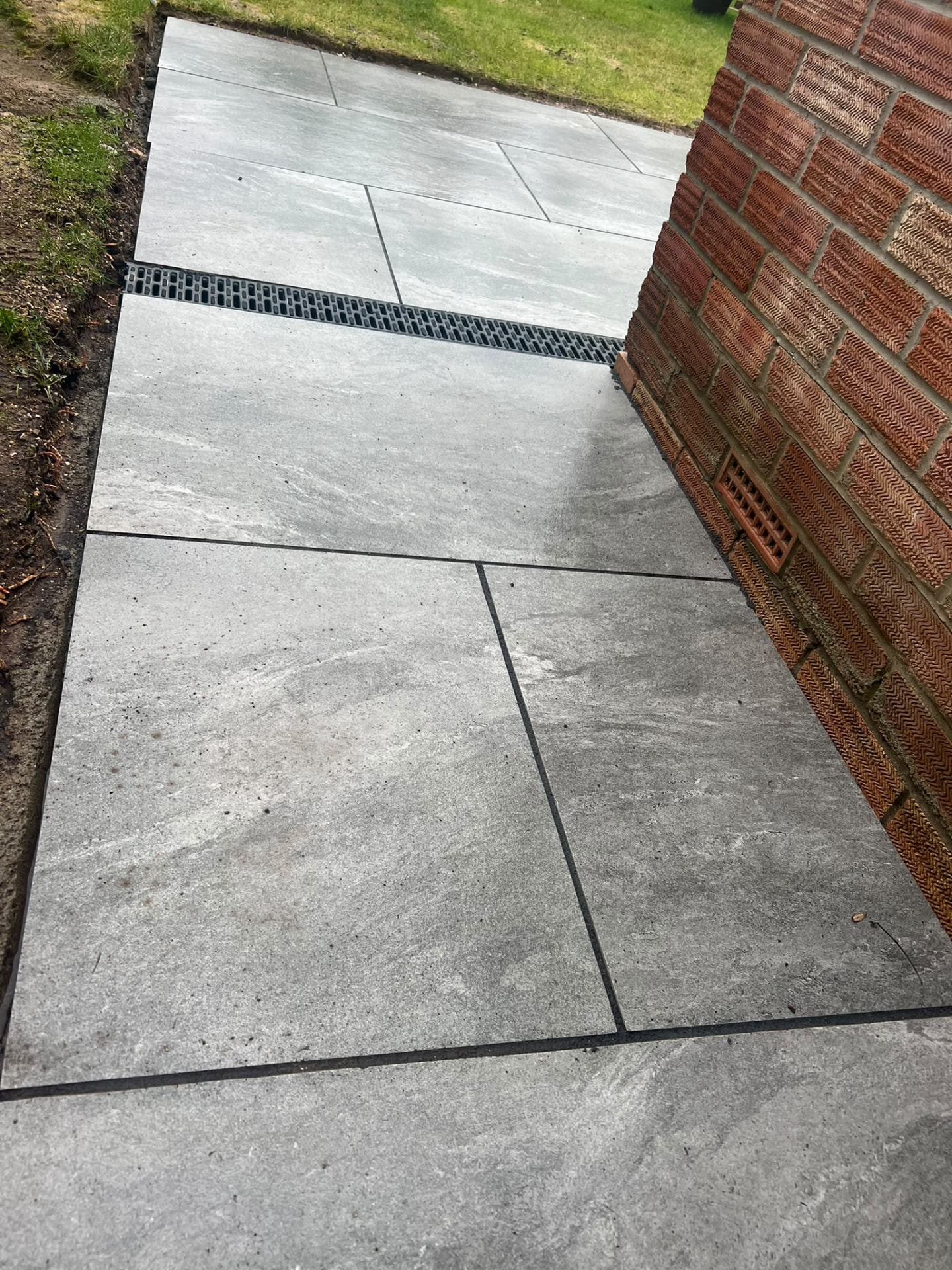 Porcelain patio laid by PC Landscaping at a property in South Devon