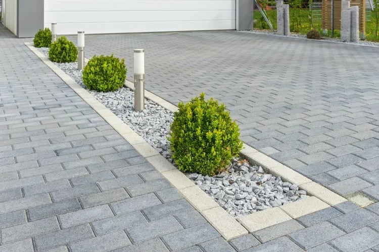 Resin-bound driveway laid by PC Landscaping at a property in South Devon, edged with kerbs